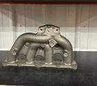 New Oem Mitsubishi 2008-2015 Lancer Exhaust Manifold Header 1555A476. Price: $760.00.