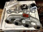 Mitsubishi S4L Exhaust Manifold New. Price: $190.00.